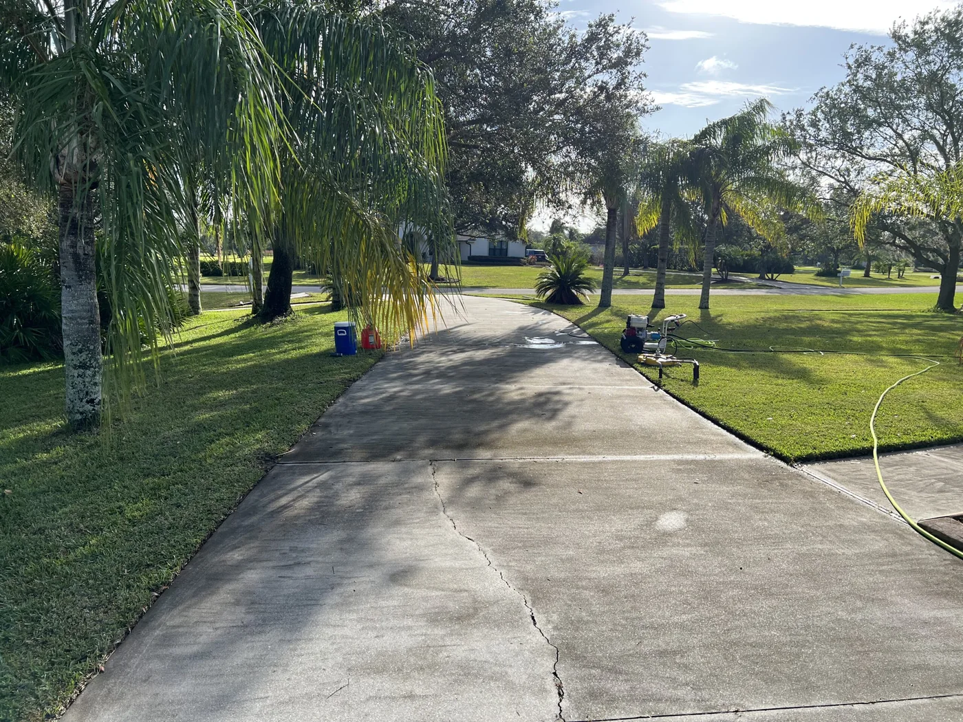 Dirty algae-stained walkway before pressure washing in Lakewood Ranch