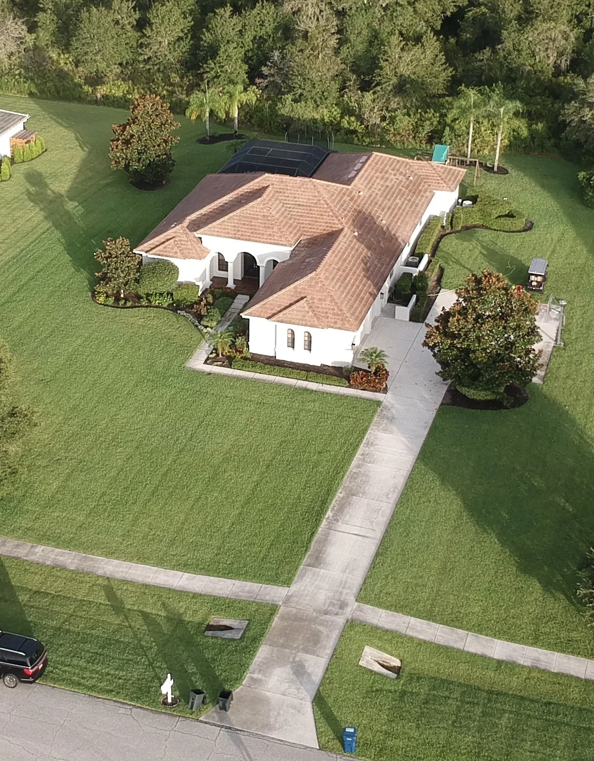 Stained driveway before full driveway package in Bradenton